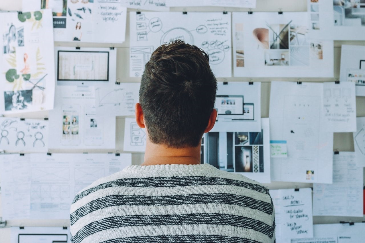 person looking at charts on wall